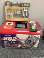 Tool set in blow mold case with label showing included items and drill bit set on top