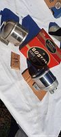 Two Boston pencil sharpeners and original Boston Pencil Sharpener box displayed on white cloth outside. Includes instruction leaflet.