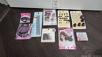 Overview photo of entire lot showing hair combs, assorted clips, elastic bands, and small portable mirror.