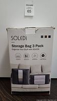 Box front showing brand Soledi, product name Storage Bag 3 Pack, product features including dust proof, waterproof, breathable, large capacity, and color options.