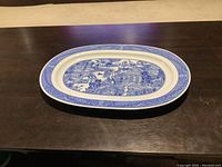 Full oval platter showing overall shape and border pattern.