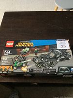 Photo of the sealed Lego DC Comics Super Heroes Kryptonite Interception set with full box showing vehicle and forklift with Kryptonite and three mini-figures.