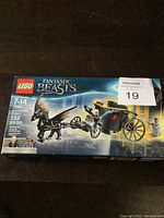Front view of sealed LEGO Fantastic Beasts box showing the entire set and contents depicted on box.