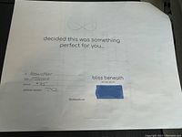 Photo of the physical $75 gift certificate for Bliss Beneath store, showing handwritten value and recipient name.