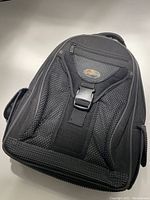 Front view of Lowepro laptop bag with padded, mesh back and zipper compartments visible