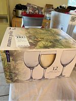 Box of 12 Luminarc Nuance wine goblets, new in box, showing brand and quantity.