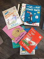 Lot of 10 hardcover children's books stacked, including Dr. Seuss titles and P.D. Eastman books.