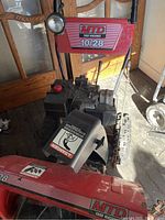 Front view showing chute, headlight and model decal