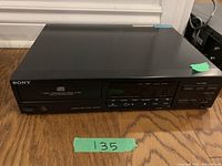 Front view of Sony CD player CDP-M37, showing power button, display, and control buttons.