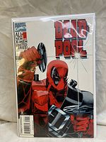 Front cover of a single Deadpool comic book showing the character holding a dumbbell with Marvel Comics branding and series details.