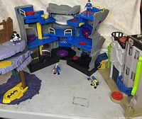 Wide shot showing multiple Imaginext Batman-themed playsets and figures on display