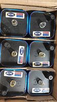 Top-down view of six 6V Rayovac alkaline batteries in a cardboard case showing spring terminals and labeling.