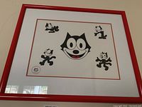 Framed Felix the Cat serigraph showing the central piece and surrounding images with red frame and double matting.