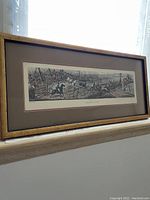 Framed lithograph titled 'Breaking Cover' showing a historic English fox hunting scene with multiple riders and hounds.