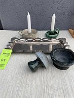 Photo of the silver plate Godinger tray, two ceramic chamberstick candleholders, marble mortar and pestle on a striped cloth background.