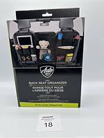 Front-facing image of the Auto Drive 3-in-1 back seat organizer packaging showing product image and branding.