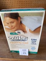 Front view of the SoftHeat heating pad box showing product name, features, and size