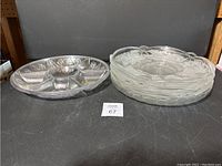 Overview of all six trays together showing difference in material and design between plastic and glass trays