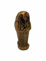 Front view of an Egyptian sarcophagus figurine showing the detailed gold and black face and crossed arms design.