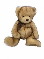 Front view image of the stuffed child's teddy bear toy showing light brown mottled plush fur, dark brown nose, black eyes, and dark ribbon bow around the neck.