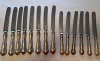 All 14 knives laid out showing handles and blades