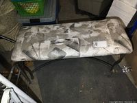 Bench top view showing patterned fabric upholstery with grey, white, and black abstract brushstroke design.