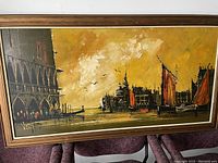 Overall view of large horizontal oil painting on masonite with frame, featuring boats and buildings under a cloudy sky in warm tones.
