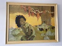 Front view of the mid-century modern print showing a child holding a sheep with multiple sheep and a tree in the background, behind glass and framed in light wood.