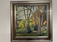 Frontal view of framed oil painting showing tree landscape scene.