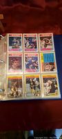 Nine cards displayed in 3×3 pocket page, includes Wayne Gretzky “In Action,” rookie and veteran cards