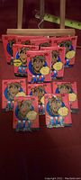 12 unopened ALF trading card packs with bubble gum, all in excellent condition.