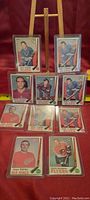 Ten 1969-70 O-Pee-Chee hockey rookie cards displayed, showing players from Blues, Kings, Red Wings, and Flyers.