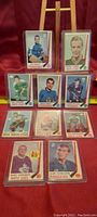 Ten 1969-70 OPC hockey rookie cards displayed in two rows with protective sleeves. Visible player names and teams include Joe Daley (Penguins), Danny O'Shea (North Stars), Alan Hamilton (Rangers), and Mark Edwards (Maple Leafs).