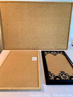 Three bulletin boards displayed on a flat surface: large cork board in back, medium light wood framed cork board front left, small black framed decorative cork board front right.