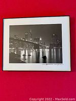 Framed black and white photo of New York City skyline at night featuring the Twin Towers and Brooklyn Bridge.