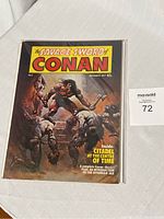 Comic book cover showing Conan and other characters with title and cover text visible.