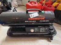 Side view showing Remington logo, model number REM-70T-KFA and 70,000 BTU label on black cylindrical body