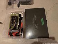 overall view of tap and die case and clear bin with Master Lock packages