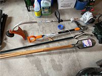 All four tools laid out on concrete floor