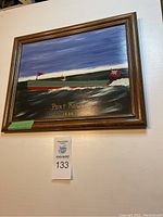 Full view of one framed painting showing a boat with red flags on water, labeled 'Port Rowan 1932' signed D.Tis.