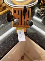 Top-down view of the wooden knife block with three visible knives inserted.