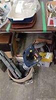 Overview of the lot showing the Mastercraft reciprocating saw in a bucket along with other tools and accessories.