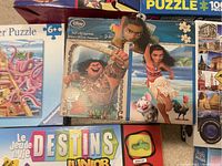Disney Moana 2-in-1 Puzzle and Destins Junior board game with visible packaging and characters showing condition and type.