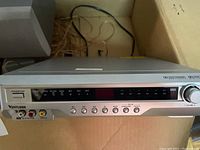 Front view of the Venturer receiver showing control buttons, display, and volume knob.