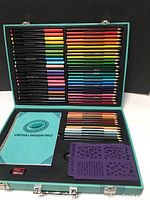 Virtual Design Pro colored pencils and markers organized inside teal case with instruction booklet and a purple stencil.