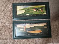 Two framed golf art pieces side by side on floor, one for British Open, one for US Open.