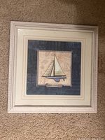 Framed and matted print titled 'The Seagull' featuring a sailboat and seagull on a navy nautical background.