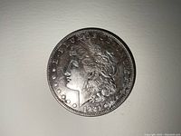 Obverse of the 1921 Morgan Silver Dollar showing Lady Liberty profile and year 1921.