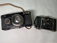 Overview of both vintage cameras side by side on white background