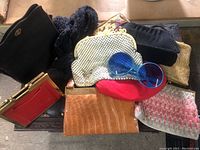 Lot showing 10 vintage purses including different fabric and leather styles and one pair of blue vintage sunglasses